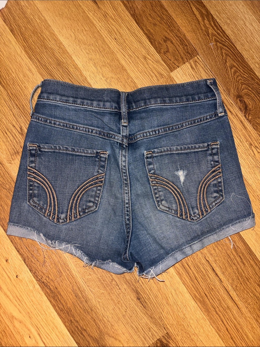 Hollister Women's High rise Distressed Denim Cutoff Shorts in Blue